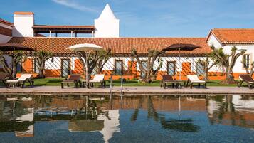 Indoor pool, 2 outdoor pools, open 9:00 AM to 8:00 PM, pool umbrellas