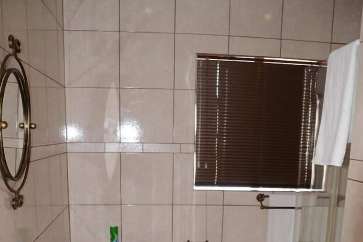 Shower, towels, soap, toilet paper