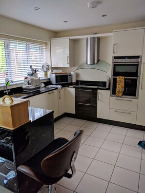 Fridge, microwave, oven, stovetop - Modern 4 Bedroom House (CORWEN)