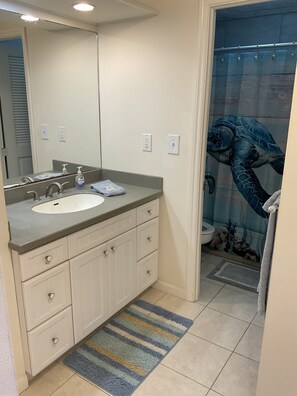 Shower, hair dryer, towels, toilet paper