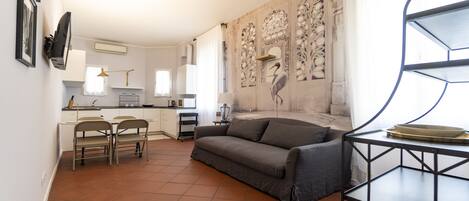 Apartment, 1 Bedroom | Living area | Flat-screen TV