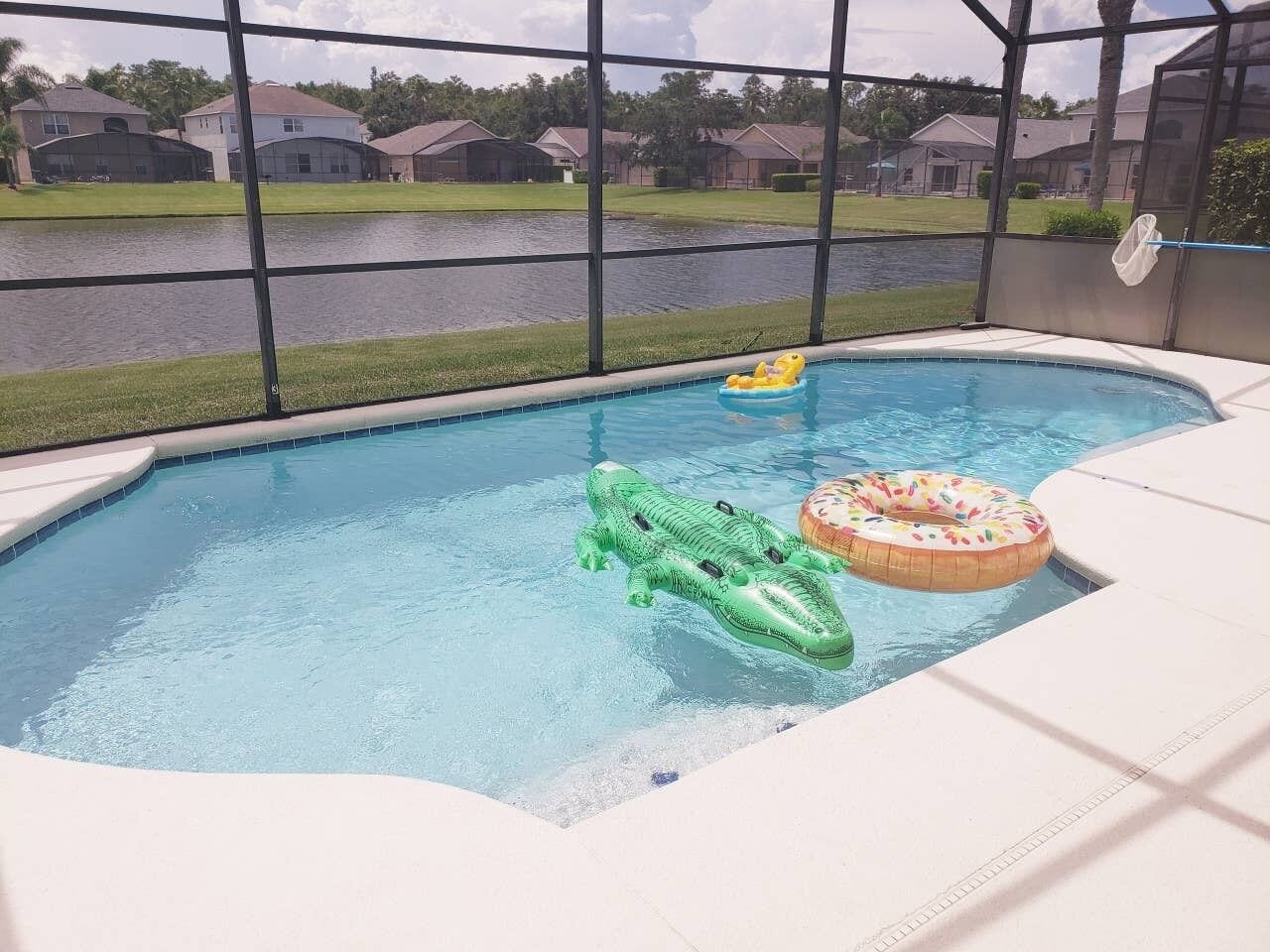 4 bedroom, 3 bath private pool home with a lake view , fully equipped and clean 
