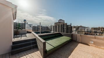 Seasonal outdoor pool, open 9:00 AM to 9:00 PM, pool loungers