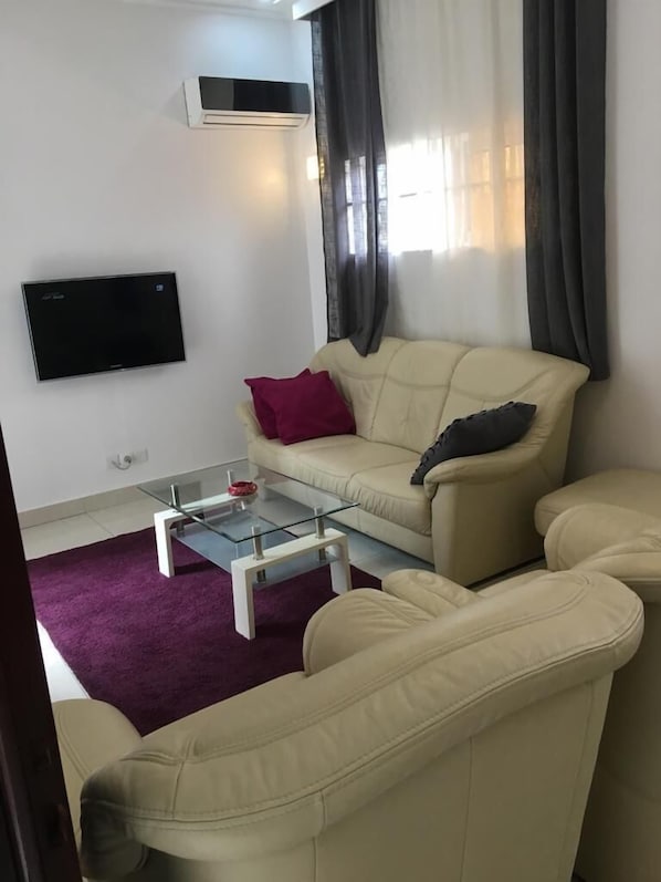 Apartment, 2 Bedrooms | Living area | Flat-screen TV - Marcelline Apparts (Cotonou)