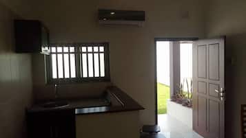 Studio, 1 Bedroom | Private kitchen | Fridge, stovetop, electric kettle, cookware/dishes/utensils