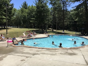 Relax by the pool surrounded by lush greenery and enjoy a refreshing swim.