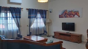 Apartment, 3 Bedrooms | Living area | Flat-screen TV - yollande fidjrosse  Apparts (Cotonou)