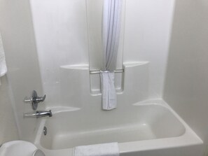 King Sized Room with Kitchenette | Bathroom | Combined shower/bathtub, hair dryer, towels, soap - Country Inn Motel (San Antonio)