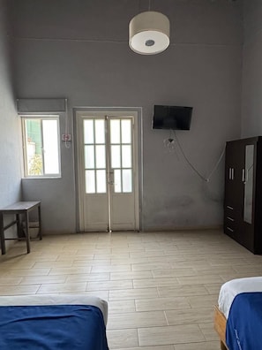 Standard Quadruple Room, 2 Double Beds | Free WiFi, bed sheets