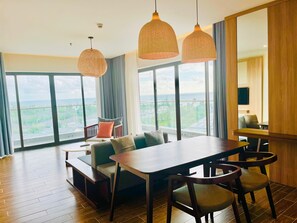 Family Quadruple Room, Balcony, Sea View | Living area | 54-inch Smart TV with cable channels, TV - Sonaga Beach Resort & Villas Phu Quoc (Phu Quoc)