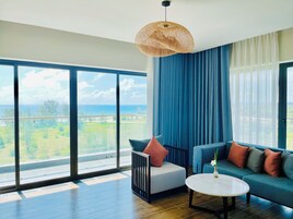 Suite Double or Twin Room, Balcony, Sea View | Living area | 54-inch Smart TV with cable channels, TV