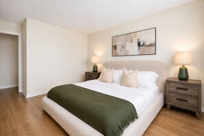 1 bedroom, desk, iron/ironing board, travel crib