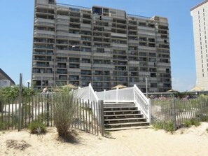 Stunning multi-story building with balconies and a gated entrance.