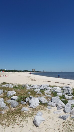 On the beach, sun-loungers