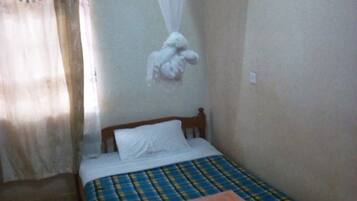 Standard Single Room | Desk, bed sheets