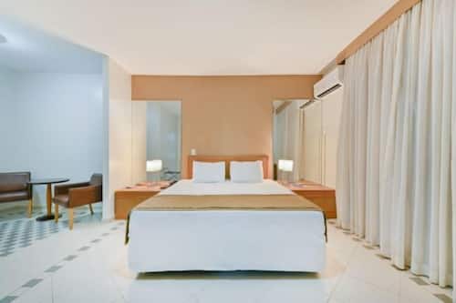 Superior Room | Minibar, in-room safe, desk, iron/ironing board