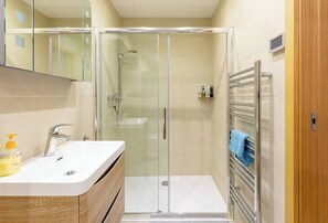 Shower, hair dryer, towels, soap