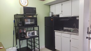 Fridge, microwave, stovetop, coffee/tea maker