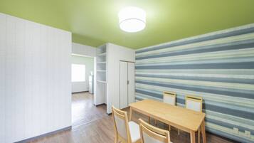 Basic Room, 2 Bedrooms | Living area | Flat-screen TV