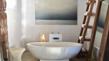 Bathtub, hair dryer, towels, soap