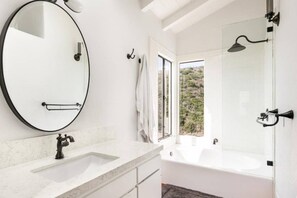Combined shower/tub, hair dryer, towels, soap