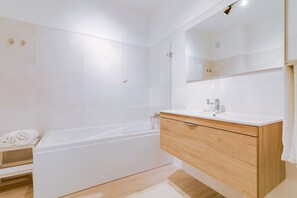 Bathtub, hair dryer, towels
