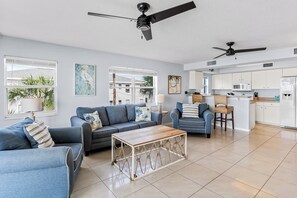 TV, DVD player, books, music library - Sand Isle II C—Beachfront Beauty w/ Pool, Sunset Balcony & Walkable Dining (Indian Rocks Beach)