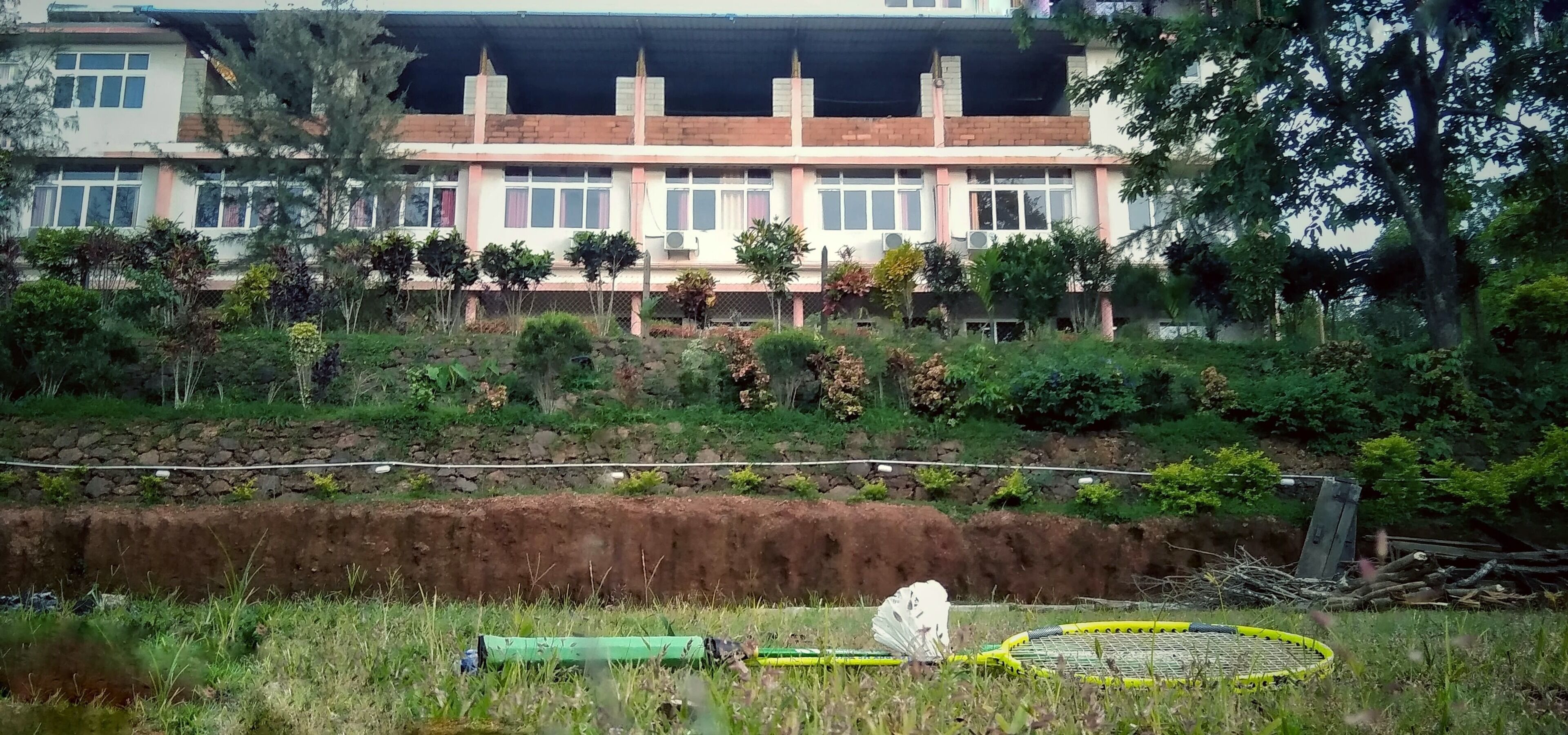 A building with multiple windows and a brick facade.