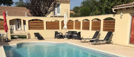 Outdoor pool, a heated pool, pool loungers