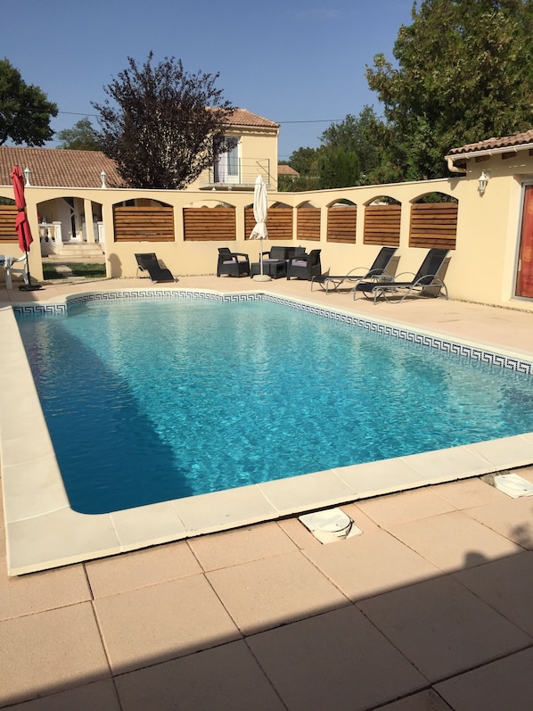 Outdoor pool, a heated pool, pool loungers