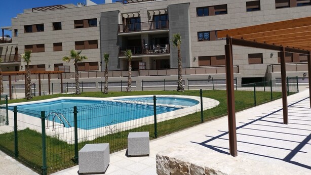 A modern building with a swimming pool, outdoor seating, and a covered area. - Holiday apartment Lime Javea - Golden star (Xàbia)