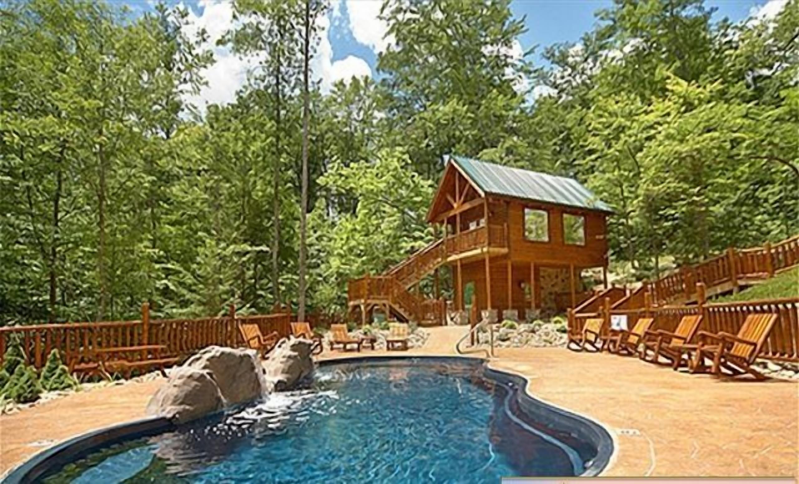 A pool area with a hot tub, wooden deck chairs, and a lodge with a metal roof.
