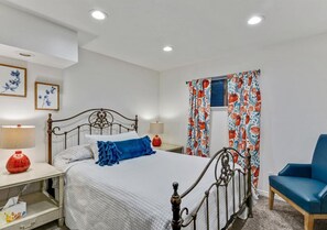 Queen bedroom with a black metal bed