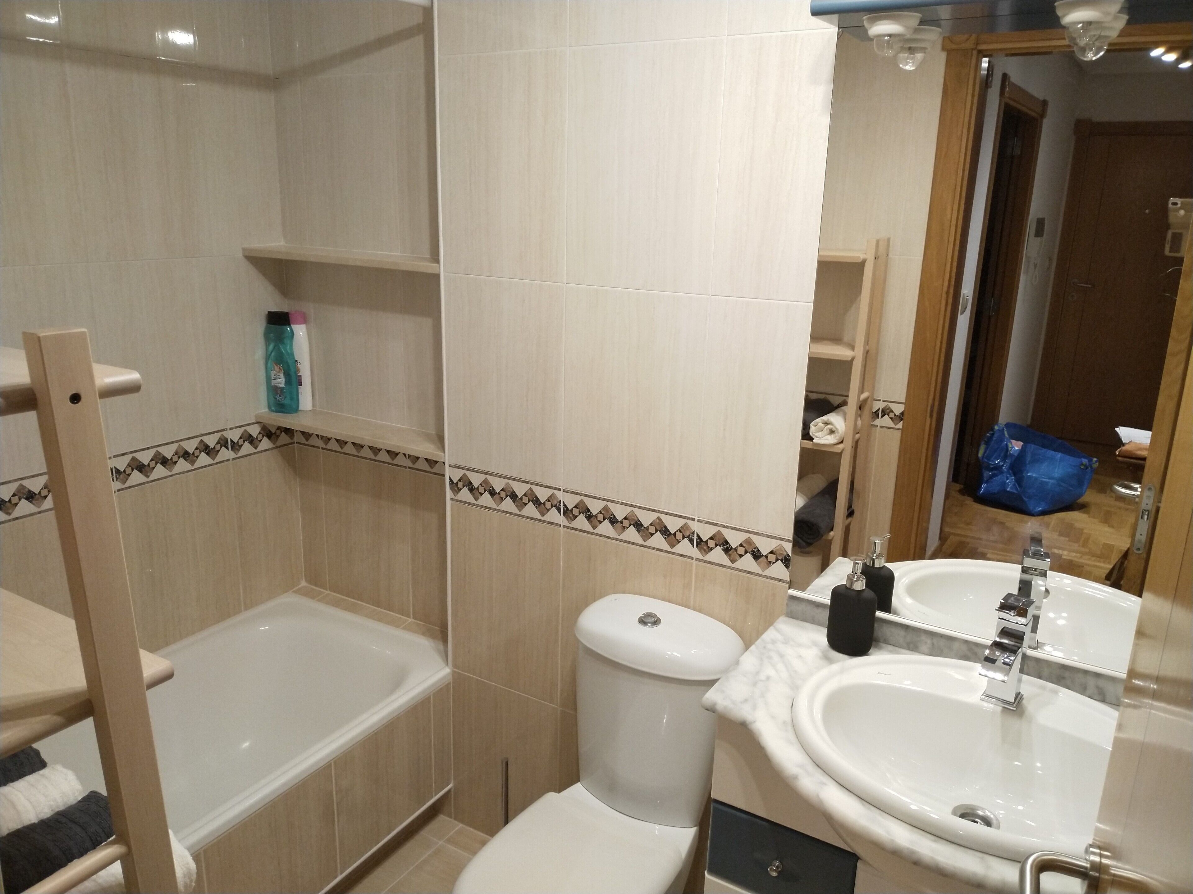 Bathtub, hair dryer, towels, soap