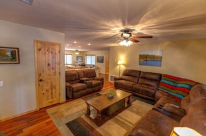 Living room looking towards kitchen back to fireplace.