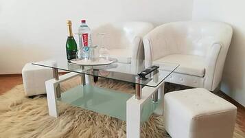 Family Room, Balcony (Deluxe) | Living area | Flat-screen TV, fireplace