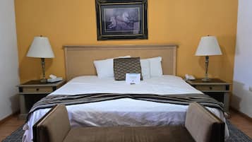 Habitación ejecutiva | Edredón, cortinas blackout, tabla de planchar con plancha y wifi gratis