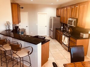 Fridge, microwave, oven, stovetop - Gold Canyon Getaway - 4 bed House with Heated Pool and Stunning Mountain Vistas (Gold Canyon)