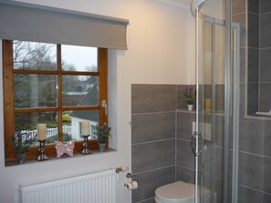 Shower, hair dryer, towels, soap