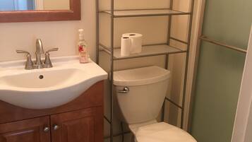 Shower, hair dryer, towels, toilet paper
