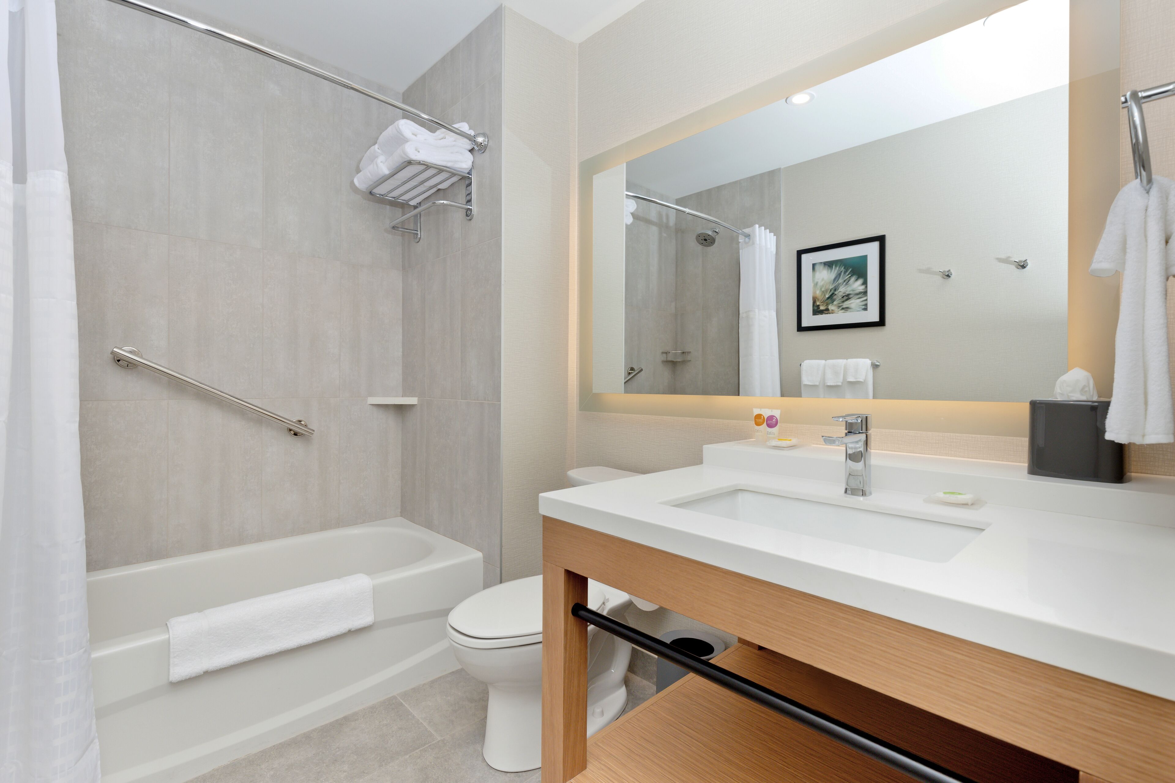 rainfall showerhead, designer toiletries, hair dryer, towels