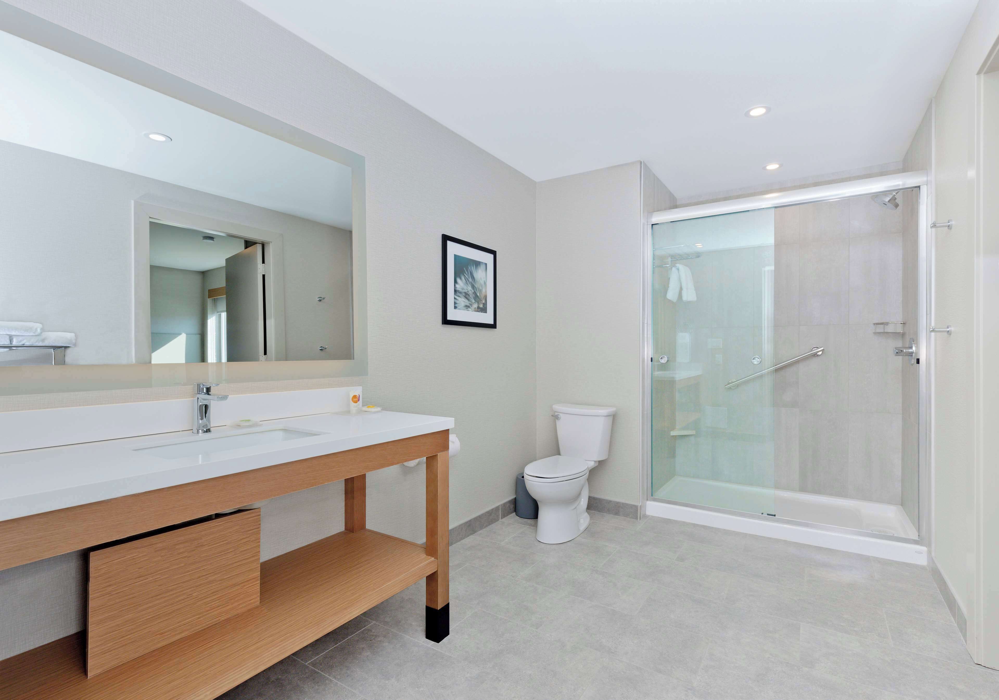 rainfall showerhead, designer toiletries, hair dryer, towels