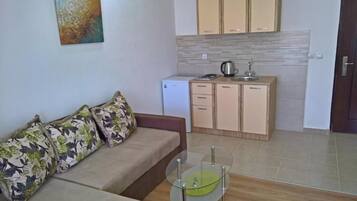 Apartemen Deluks, 1 kamar tidur | Area keluarga | TV layar datar