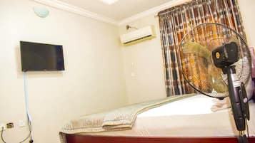 Chambre Exécutive | 1 chambre, fer et planche à repasser, Wi-Fi gratuit, draps fournis