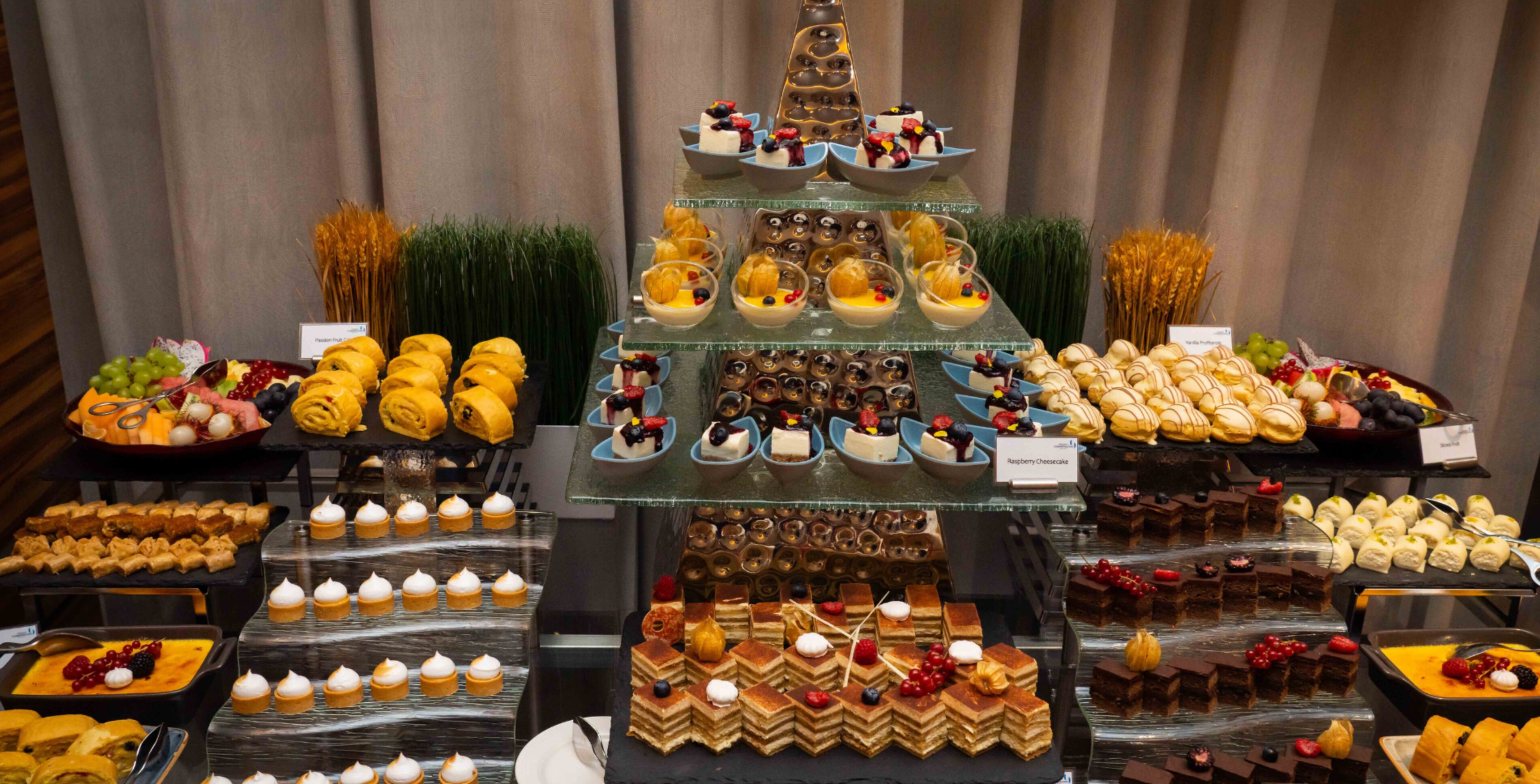 A buffet with various desserts and pastries.