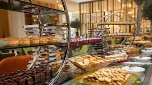 A buffet with various baked goods and desserts. - Grand Cosmopolitan Hotel (Dubai)