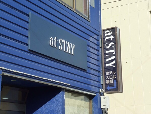 Welcome to STAY, a hotel with a convenient sign.