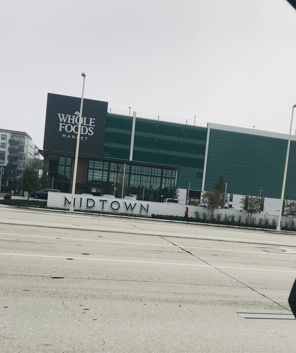A Whole Foods Market with a sign reading 'NURTOWN' in front.