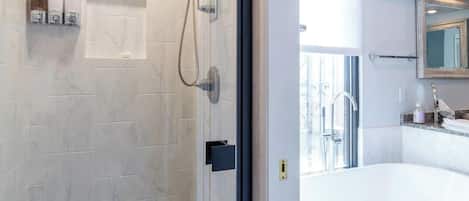 Combined shower/bathtub, hair dryer, towels, soap