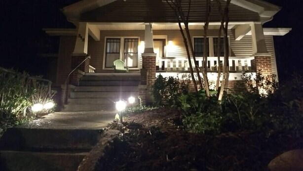 A two-story house with a front porch, steps, and a small garden area. - 2 blocks to North Chattanooga revitalized riverfront restaurants and bars. (Chattanooga)